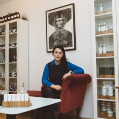 Portrait of Alexandra Soveral surrounded by her products