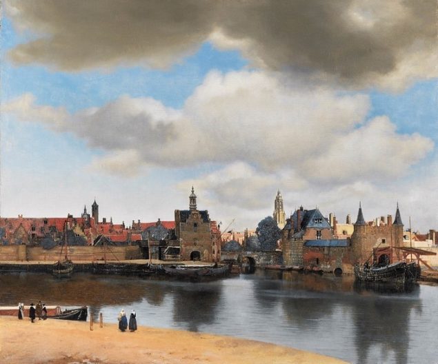 A castle with water in the background
Description automatically generated