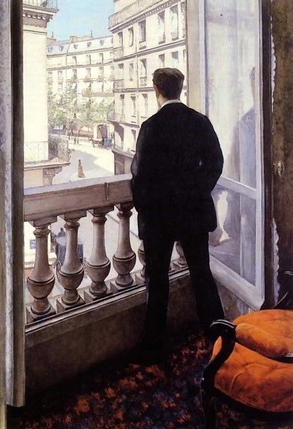 A person standing in front of a window
Description automatically generated